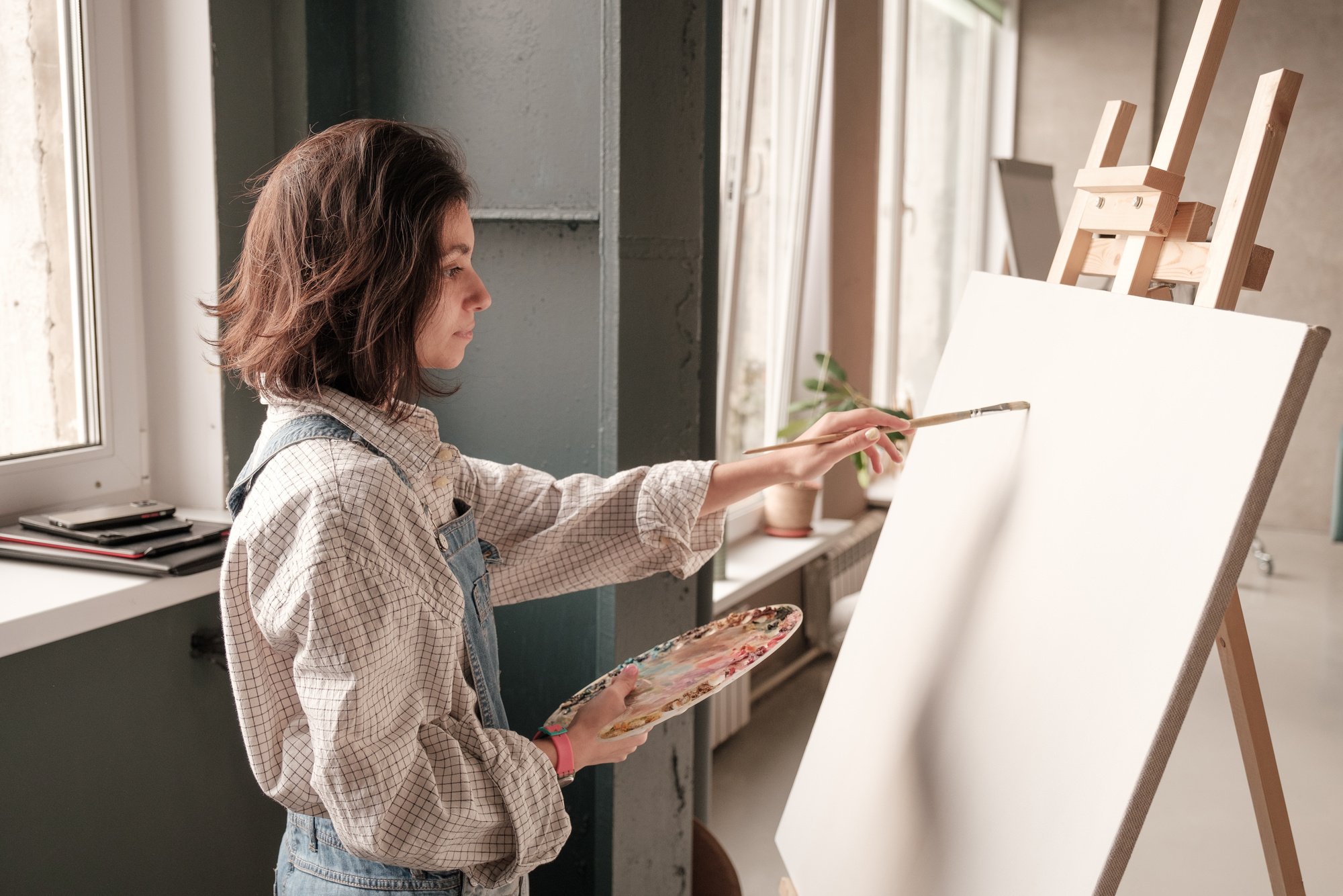 Student Doing Acrylic Painting in Art Class